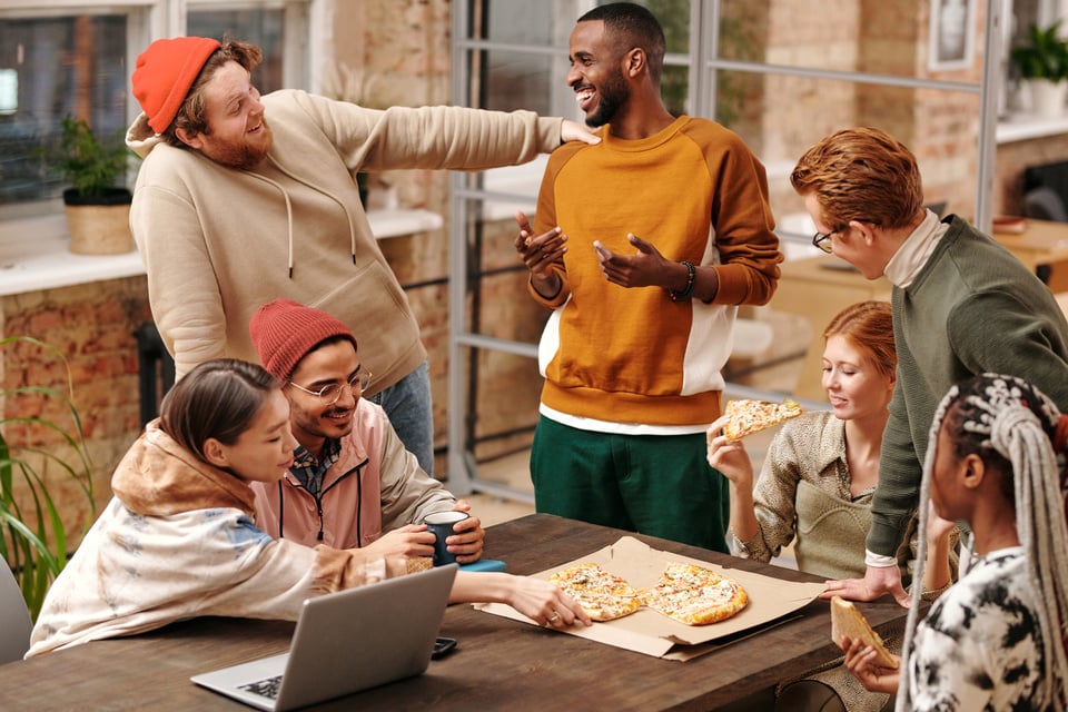 Multiracial Group of People by the Table